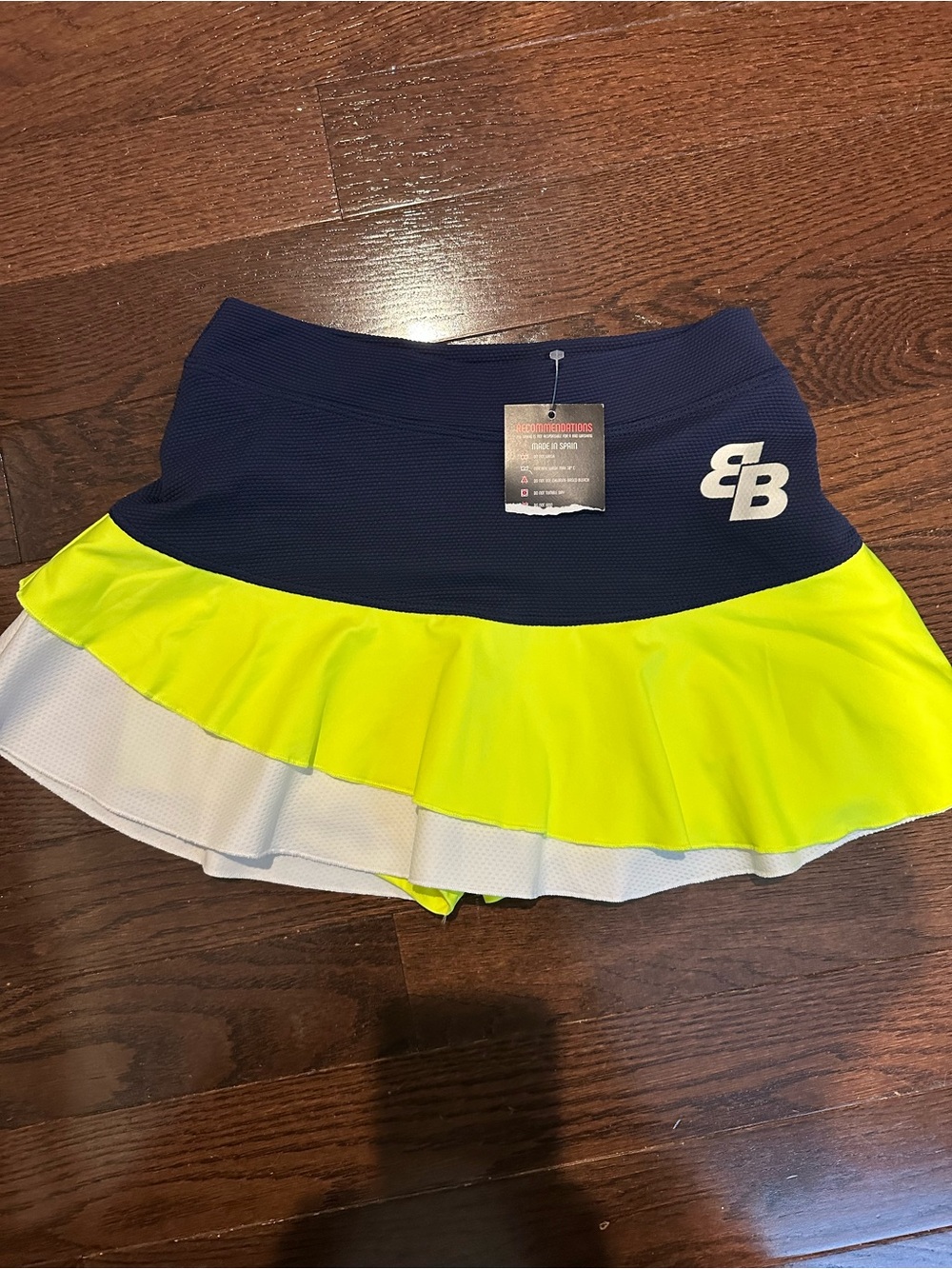 Woman’s Belen Berbel Neon Yellow and Navy Athletic Tennis Skirt